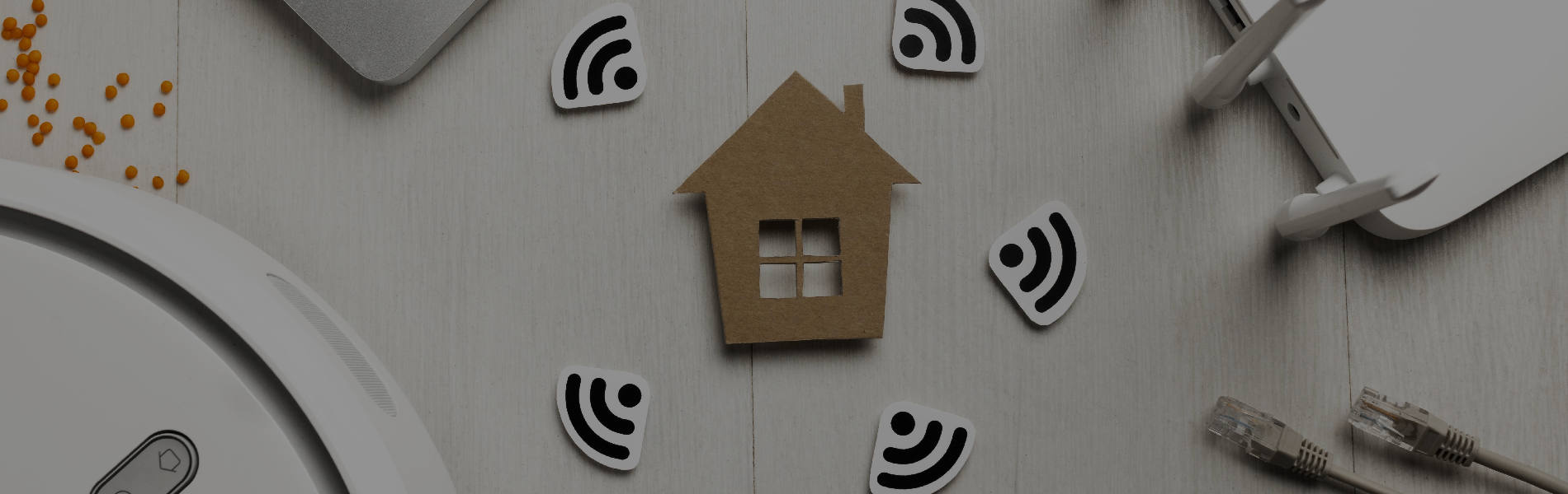 Wooden 2D house with wifi symbols around and router ethernet cable