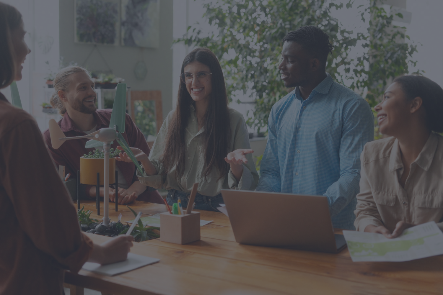 Diverse tech people trying to achieve ambitious sustainability goals