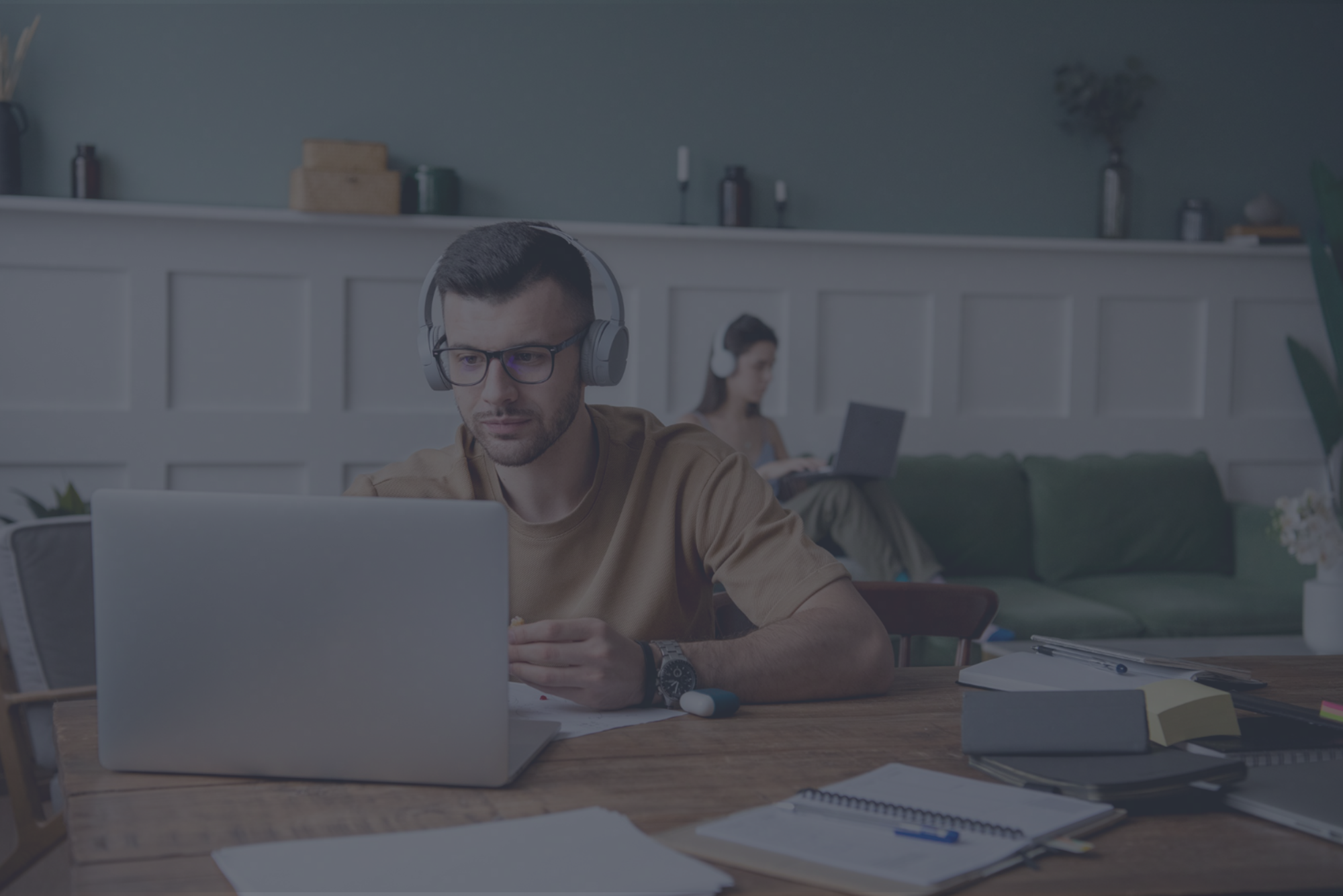 Young man listening to music during remote working